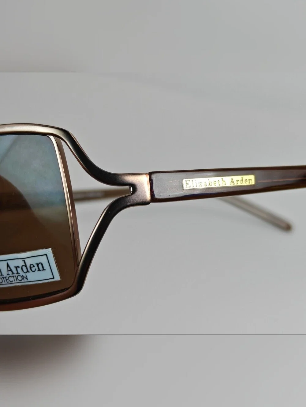 Elizabeth Arden EA5037.  Brown Rectangular Sunglasses with Tinted Brown Lenses.